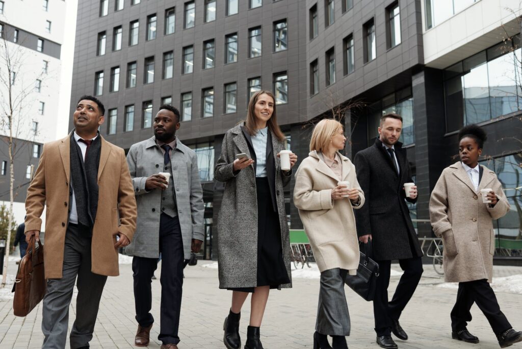 coworkers taking a coffee break and walking